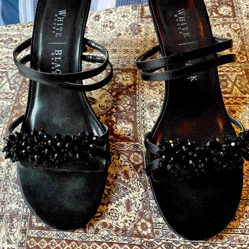 Black heels. Barely worn. Still in box.